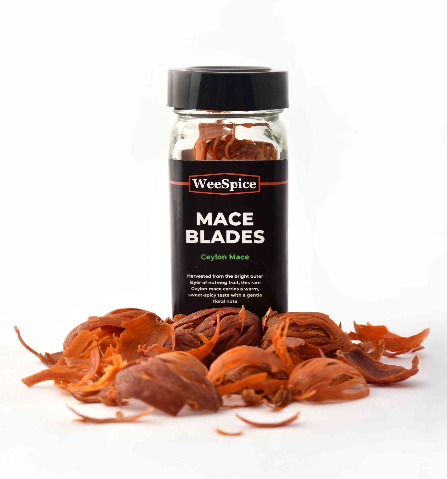 Jar of WeeSpice Mace Blades with mace blades on a white background